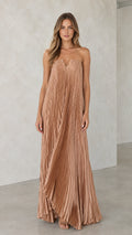 Front view of model wearing a champagne strapless pleated maxi dress with V-notch neckline