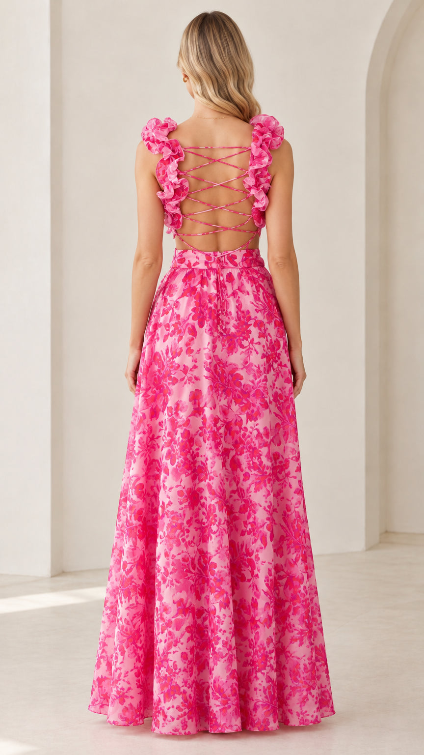 Back view of model showing strappy crisscross lace-up back on pink floral dress