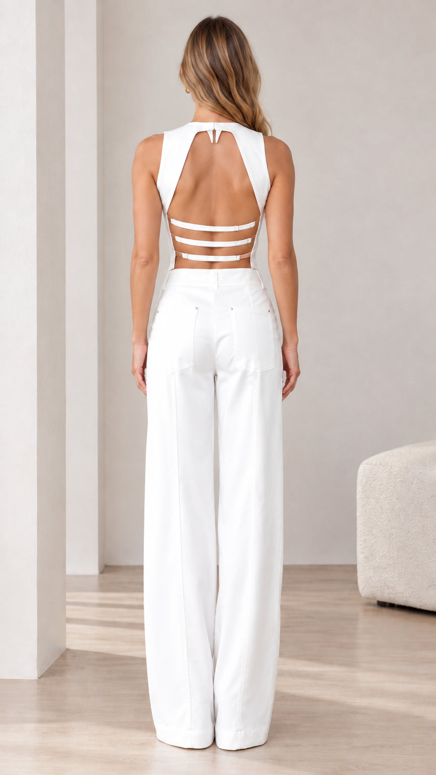 Back view of model showing strappy cutout open back detail of the white vest set