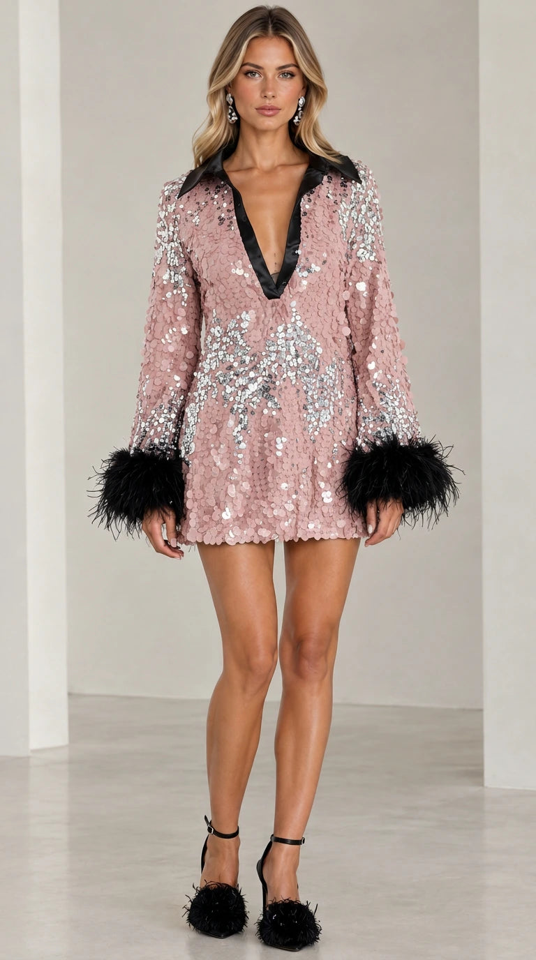 Model wearing dusty pink sequin plunge mini dress with black feather cuffs