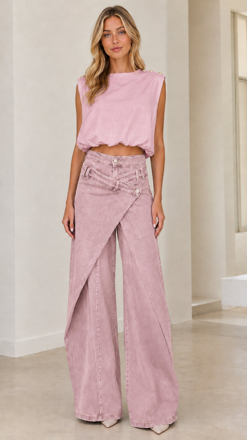 Full front view of model wearing dusty pink crossover wide leg denim trousers