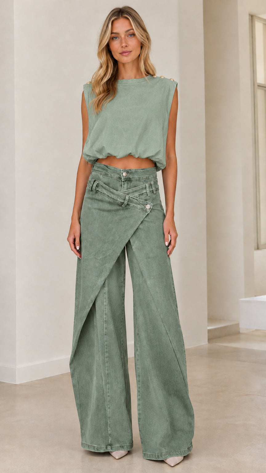 Full front view of model wearing sage green asymmetrical wide leg jeans with matching sleeveless top
