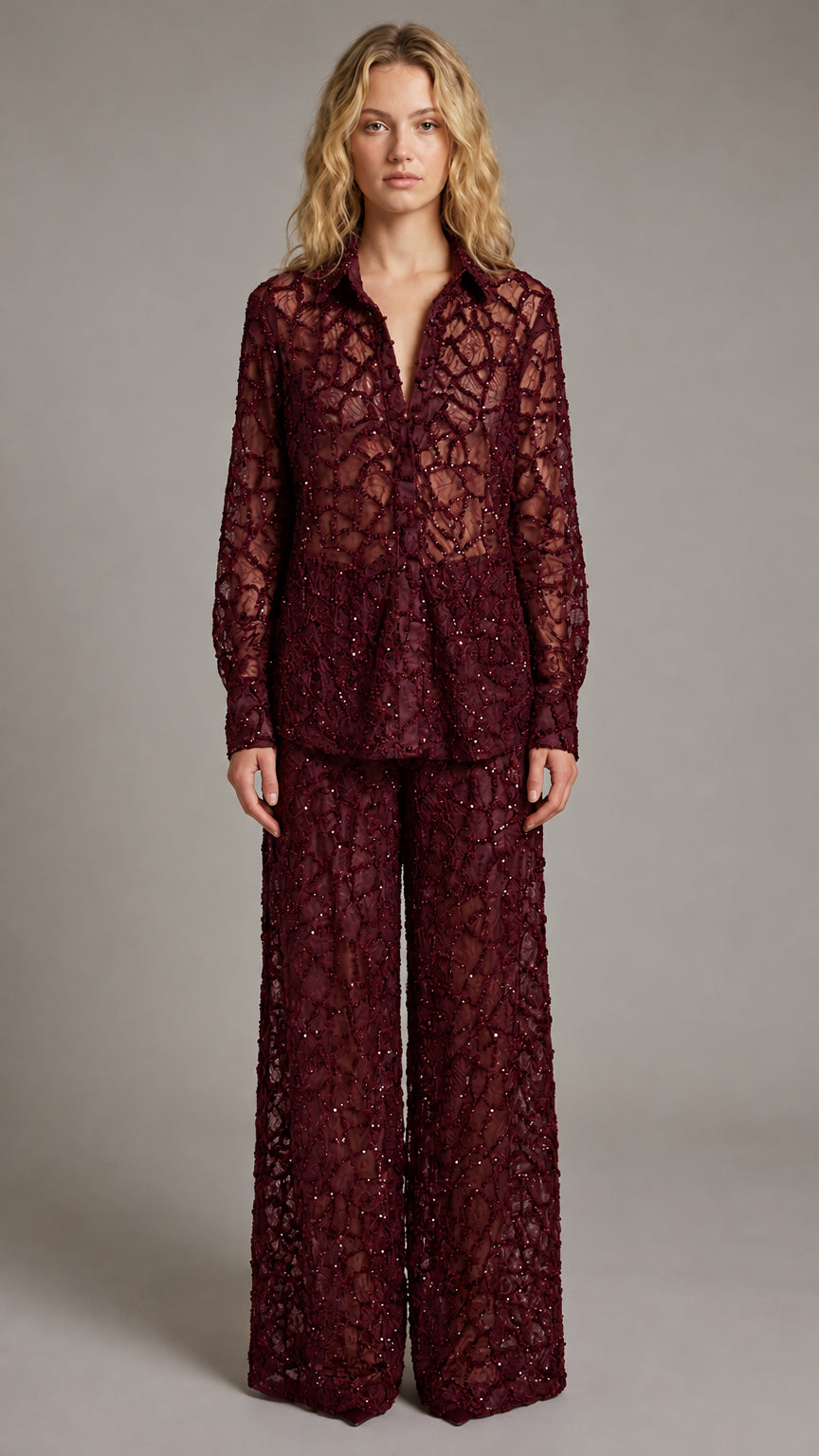 Front view of model wearing burgundy sequin lace two-piece pants set